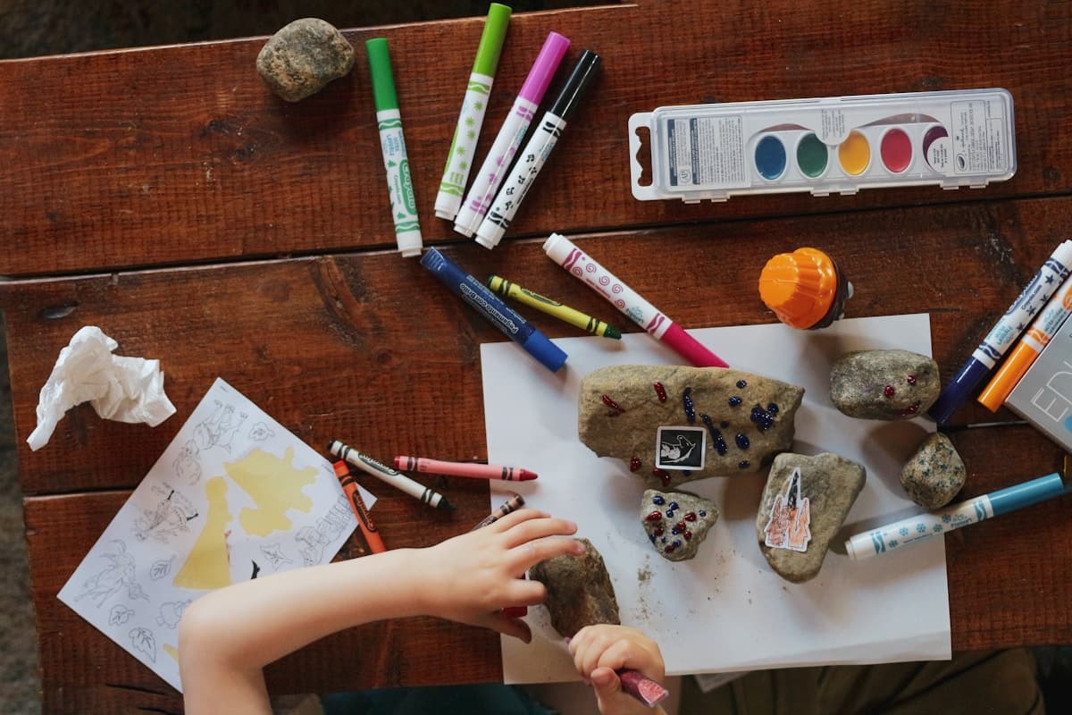 Children painting and exploring colours at nursery — creative play for early years